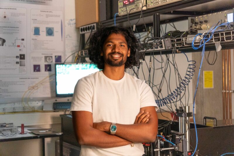 Ph D candidate Rohit Raj in his lab low res scaled