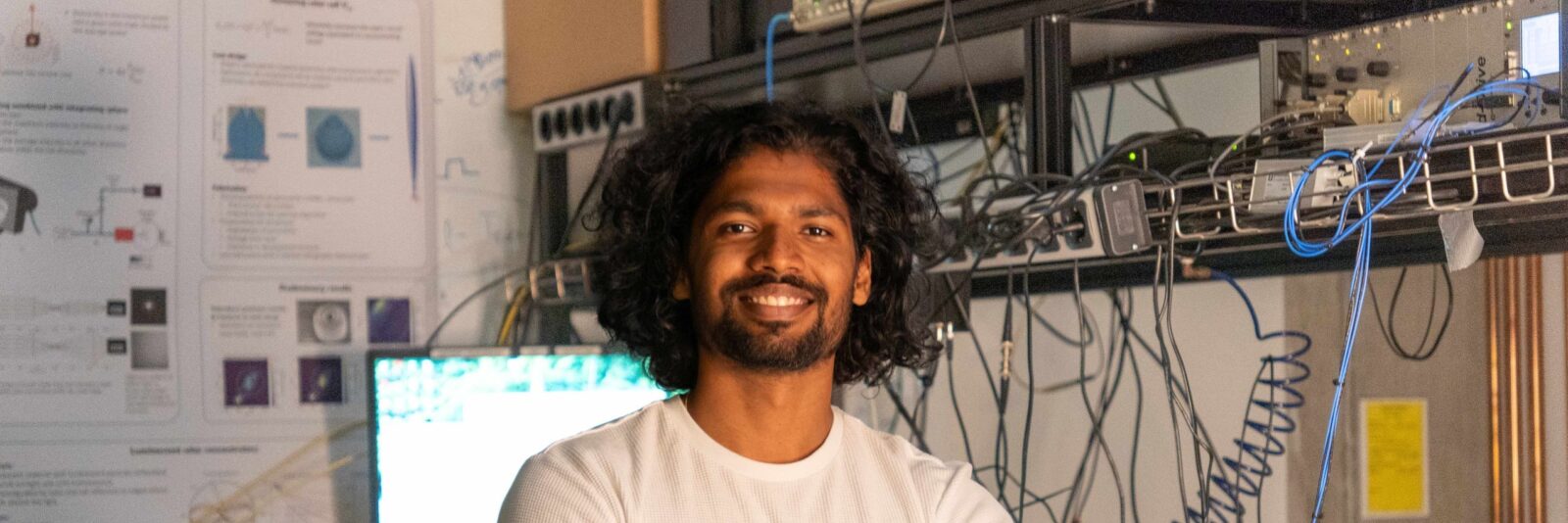 Ph D candidate Rohit Raj in his lab low res scaled